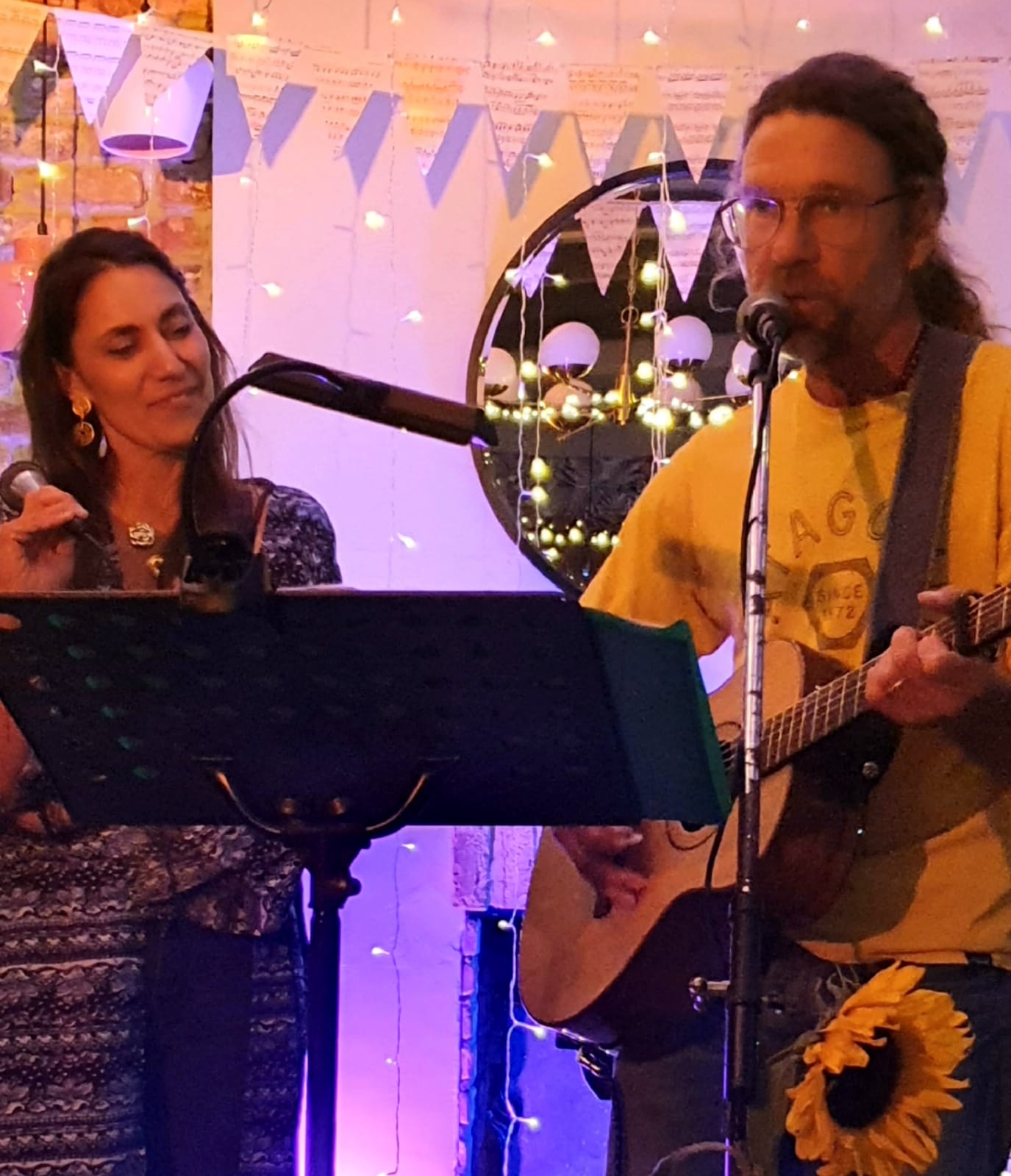 Perla and Kevin performing indoors